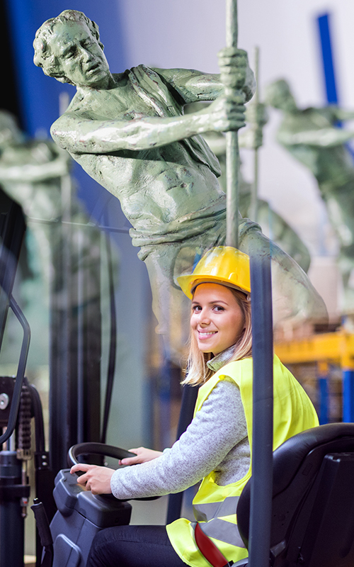 Person on forklift with the archies logo in the background