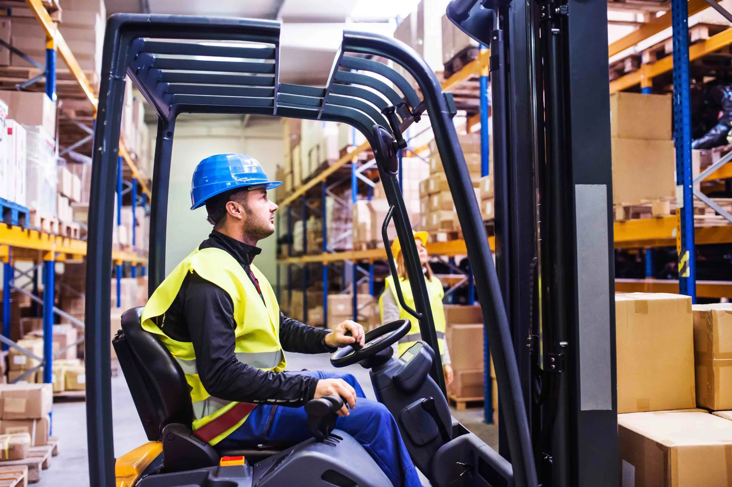 young warehouse workers working together PAURP2P scaled